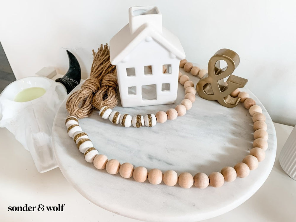 
                  
                    4ft Wood Bead Garland with 10 White Kente Krobo Beads - sonder and wolf
                  
                