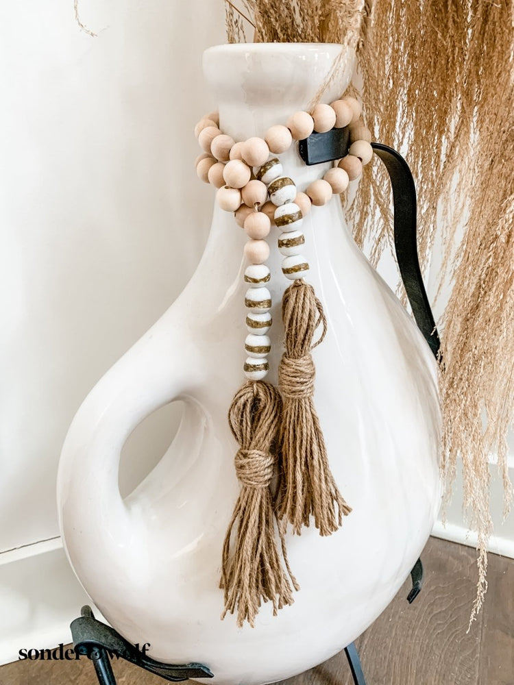 
                  
                    4ft Wood Bead Garland with 10 White Kente Krobo Beads - sonder and wolf
                  
                