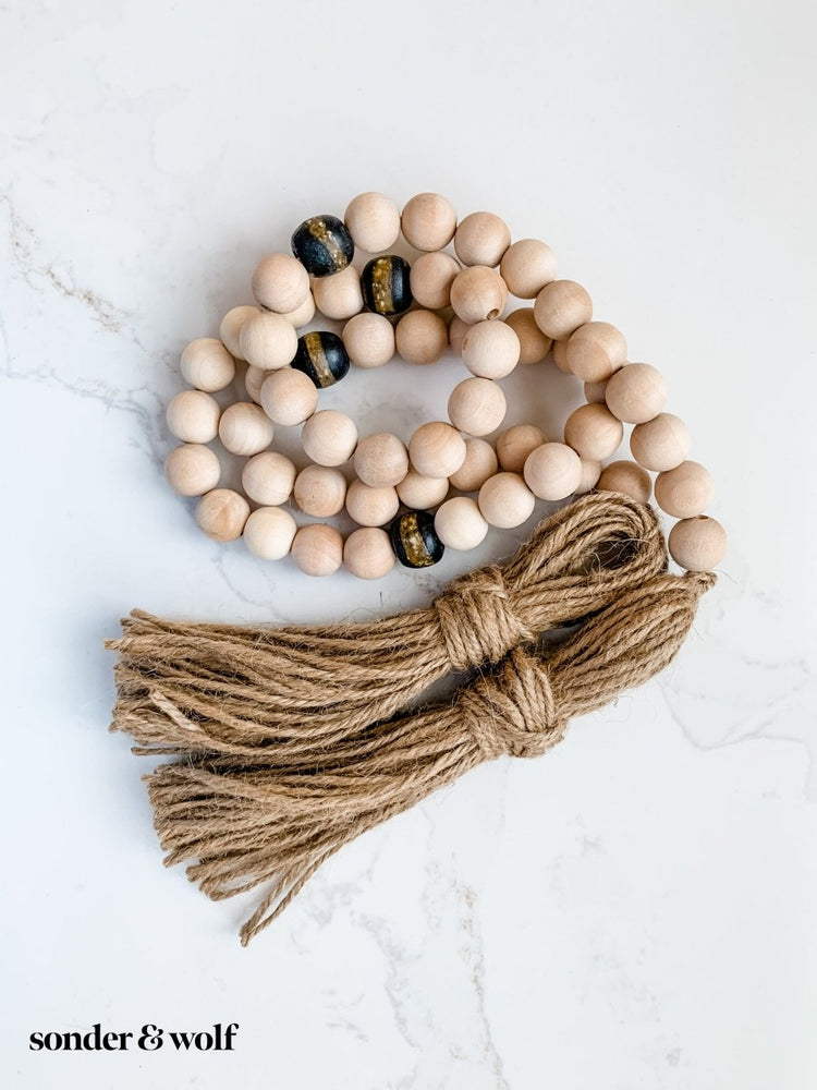 4ft Wood Bead Garland with 4 Black Kente Krobo Beads - sonder and wolf