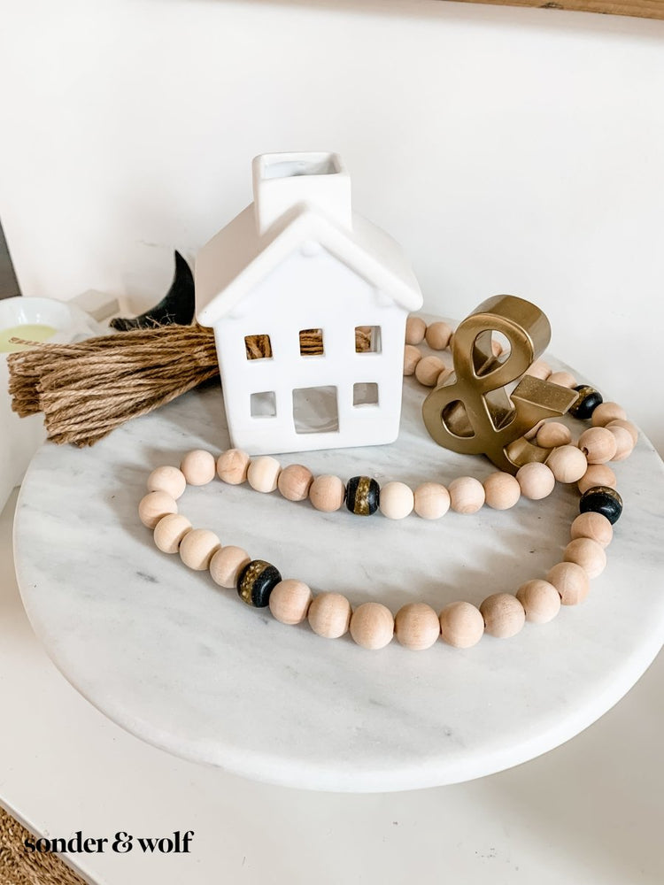 
                  
                    4ft Wood Bead Garland with 4 Black Kente Krobo Beads - sonder and wolf
                  
                