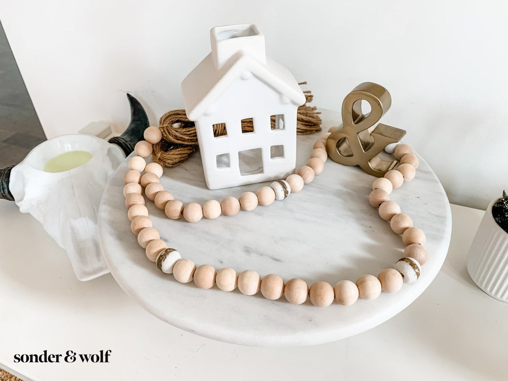 
                  
                    4ft Wood Bead Garland with 4 White Kente Krobo Beads - sonder and wolf
                  
                