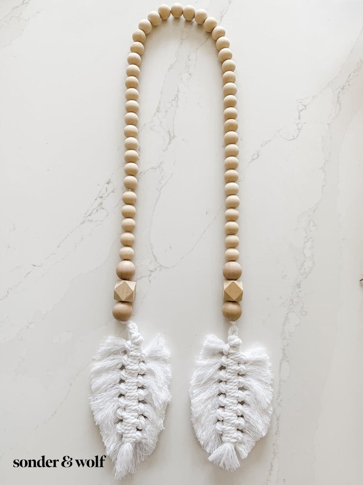 
                  
                    Macrame Feather Bead Garland - sonder and wolf
                  
                