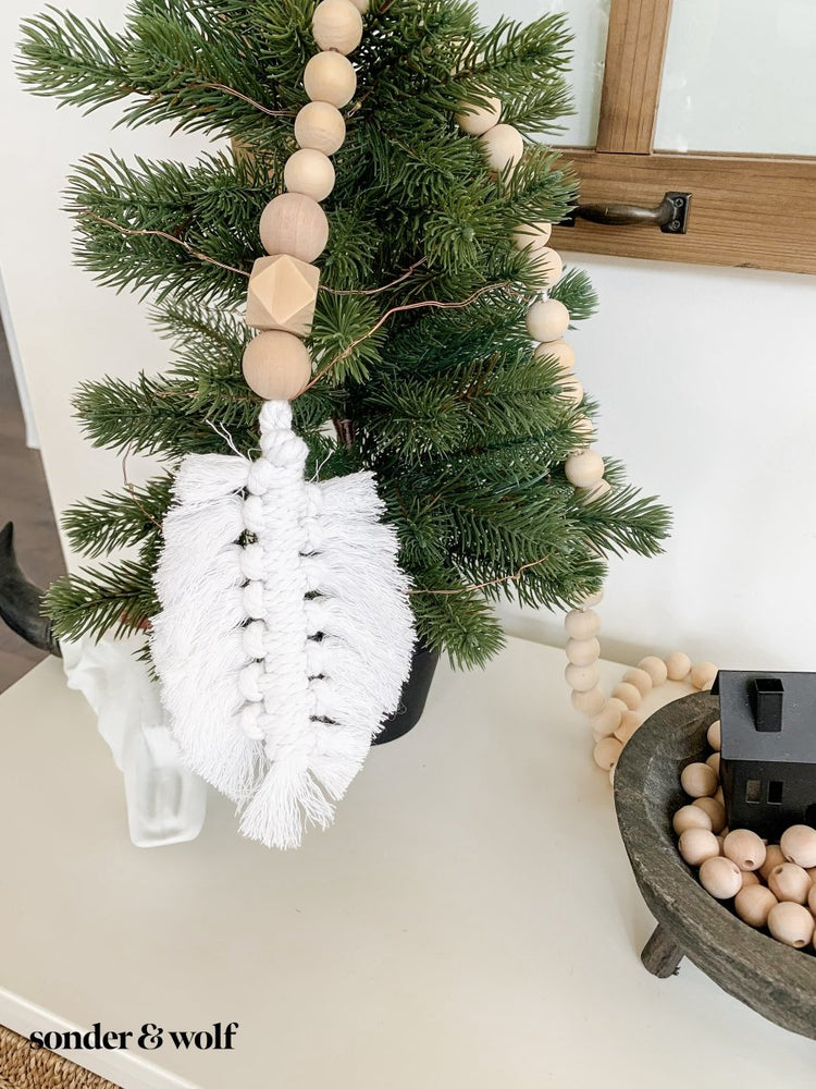 
                  
                    Macrame Feather Bead Garland - sonder and wolf
                  
                