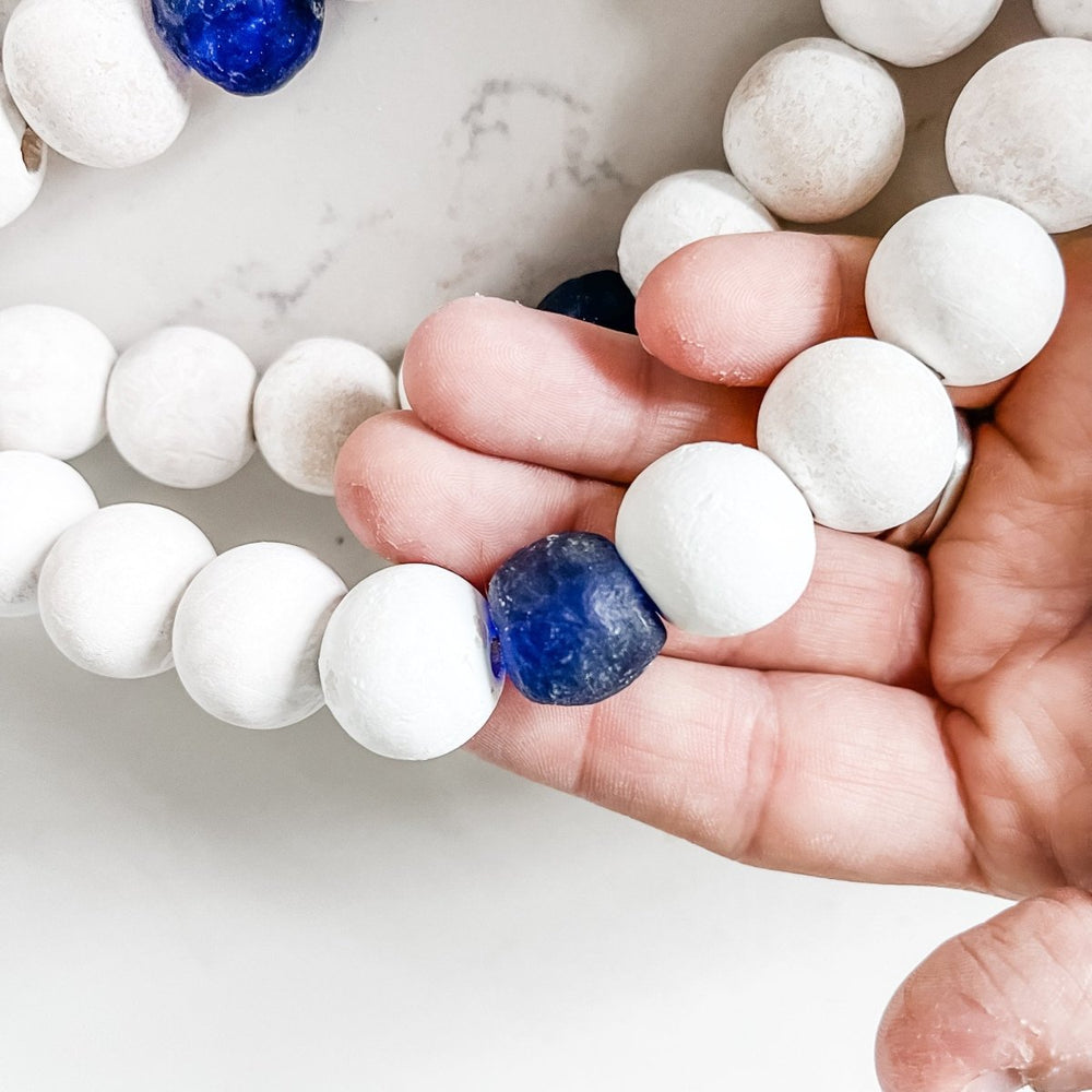 
                  
                    Whitewashed Wood Bead Garland with Jumbo Cobalt Blue Recycled Glass Beads - sonder and wolf
                  
                