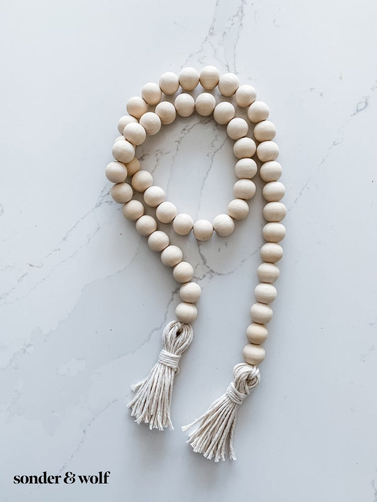 
                  
                    Wood Bead Garland with Cotton Tassels - sonder and wolf
                  
                