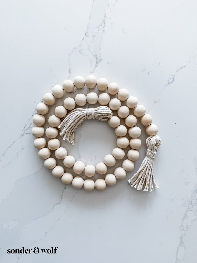 
                  
                    Wood Bead Garland with Cotton Tassels - sonder and wolf
                  
                