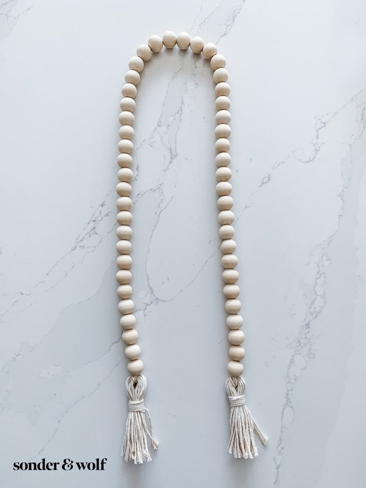 
                  
                    Wood Bead Garland with Cotton Tassels - sonder and wolf
                  
                