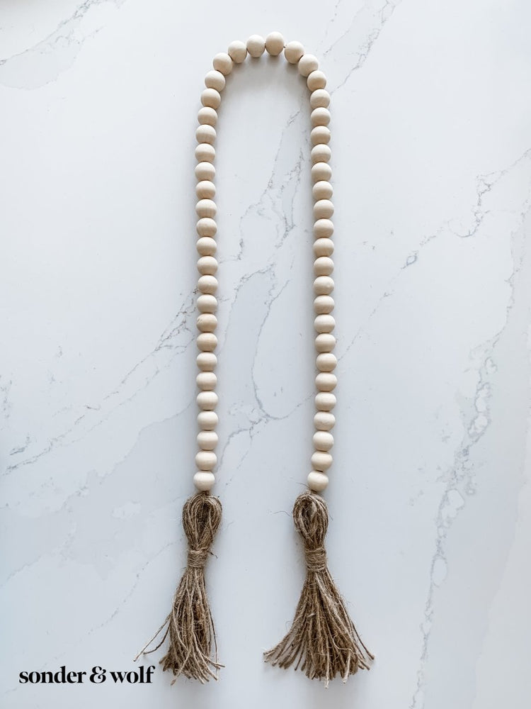 
                  
                    Wood Bead Garland with Jute Tassels - sonder and wolf
                  
                