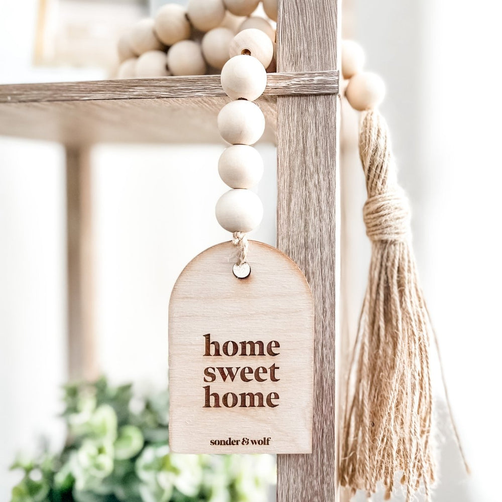 
                  
                    Wood Bead Garland with Wood Charm & Jute Tassel - sonder and wolf
                  
                