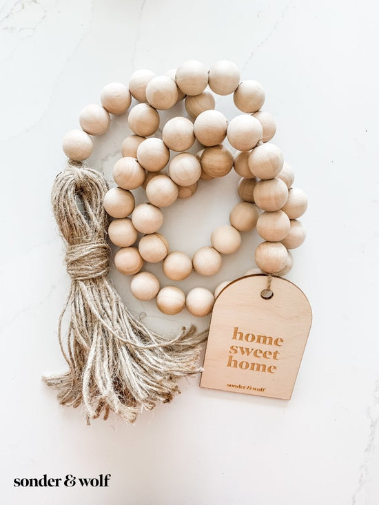 Load image into Gallery viewer, Wood Bead Garland with Wood Charm &amp;amp; Jute Tassel - sonder and wolf

