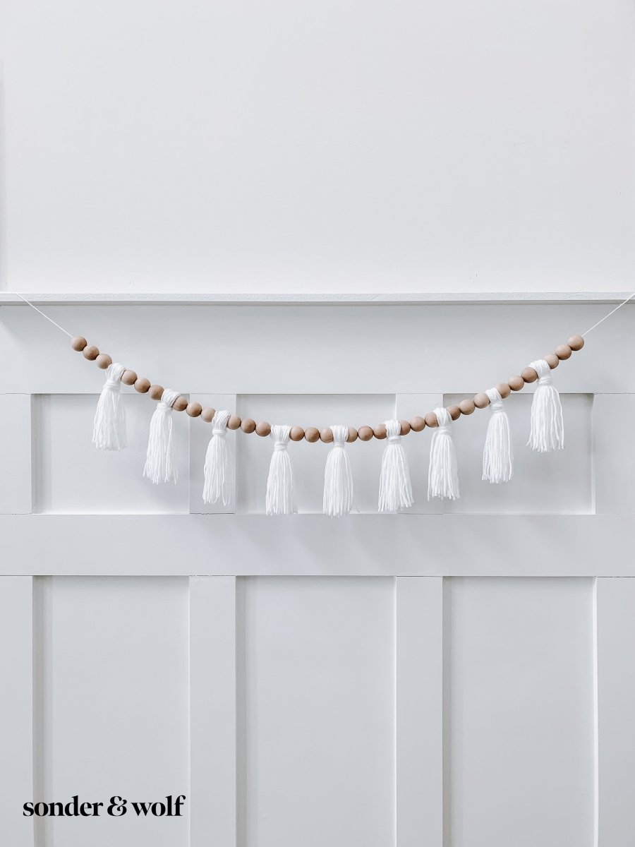 Load image into Gallery viewer, Wood Bead Garland with Yarn Tassels - sonder and wolf
